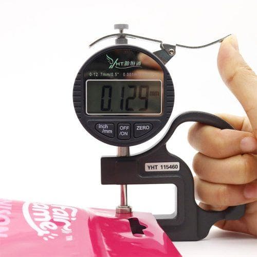 Thickness gauge measuring a flexible food packaging pouch