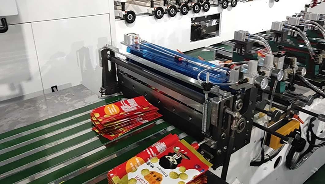 Bag-making machine producing red printed food pouches