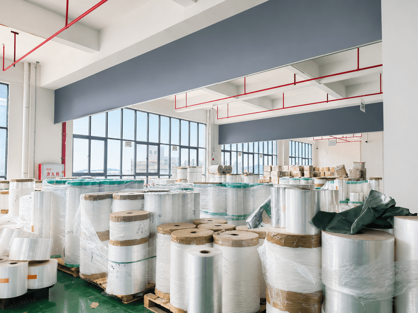 Flexible packaging raw material rolls stored inside the Full Packing factory