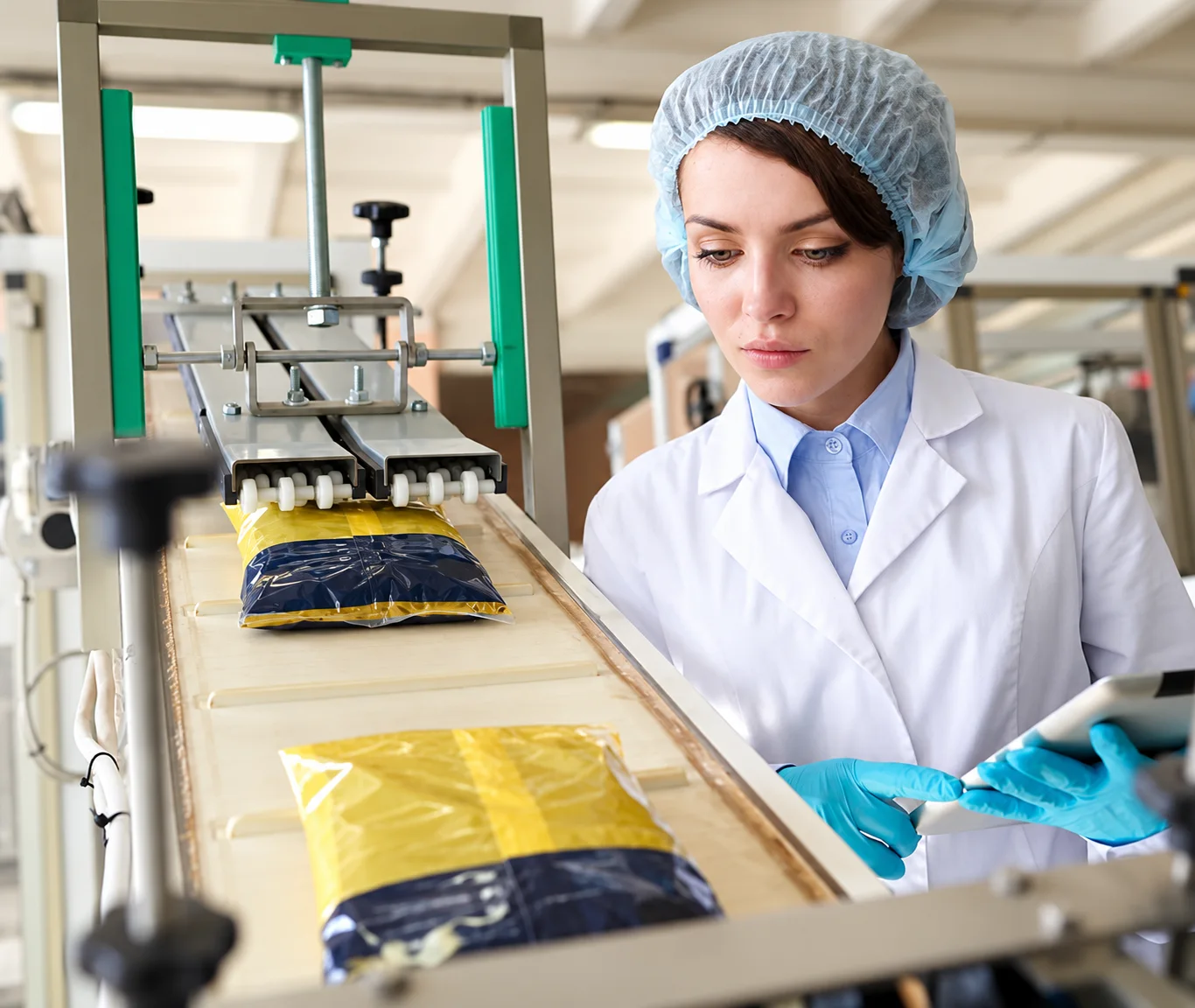 Illustration of a technician inspecting finished food pouches on a production line